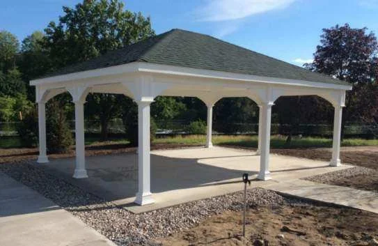 Completed outdoor pavilion with shingle roof constructed by Tindall Construction.