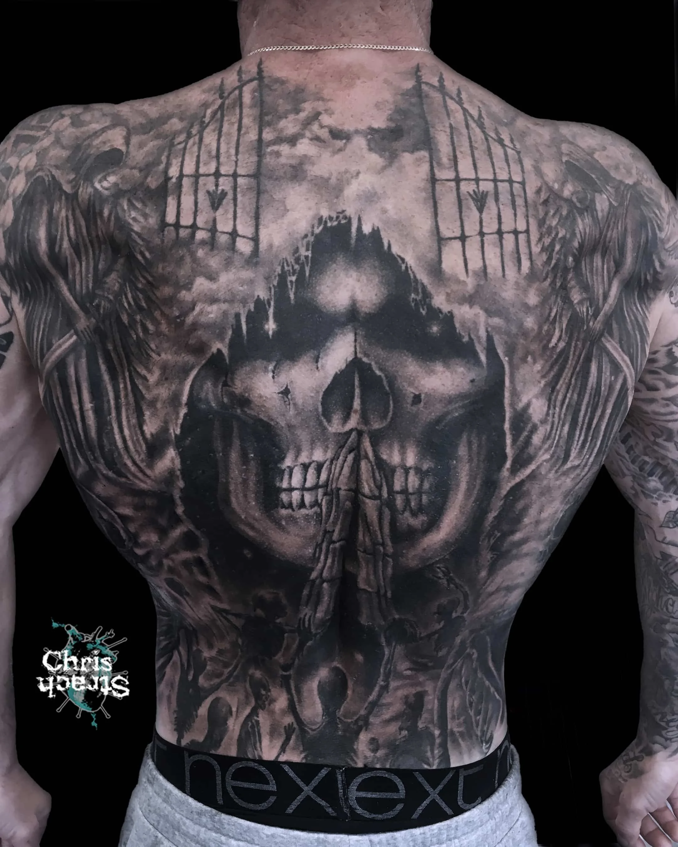 full-back-black-grey-skull-heaven-hell-chris-Strach-forbidden-arts-tattoo-york.jpg