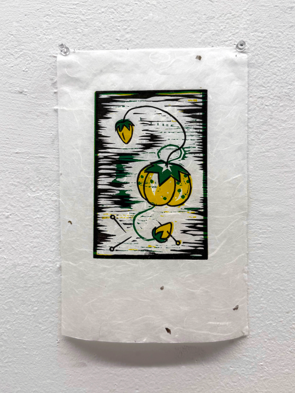 A black, yellow, and green graphic wood block print of a tomato plant on a white background, with a tomato hanging from a curved stem, a small tag, and abstract horizontal lines.