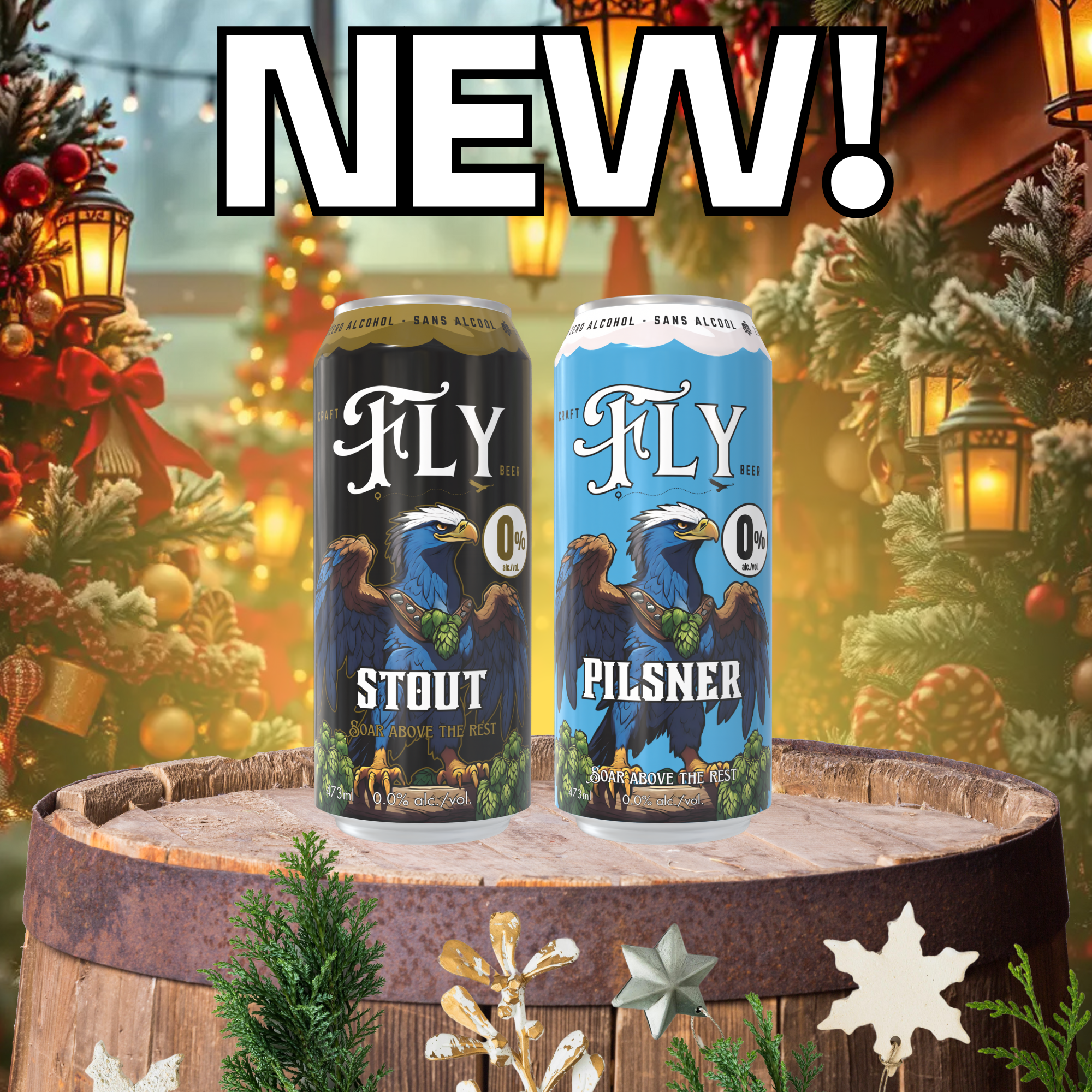 Two cans of alcohol-free craft beer on a wooden barrel with Christmas decorations in the background. One can is black labeled "Stout" and the other is blue labeled "Pilsner," both featuring an eagle illustration and the word "NEW" in large text.
