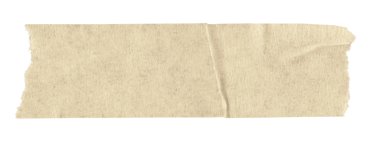 Close-up of a torn piece of beige paper or cardboard with frayed edges.