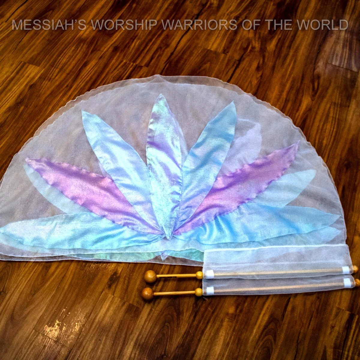 Spin-Tube worship flags with the image of a lily on them to represent how God provides for the lilies of the field in the same way He does for us.