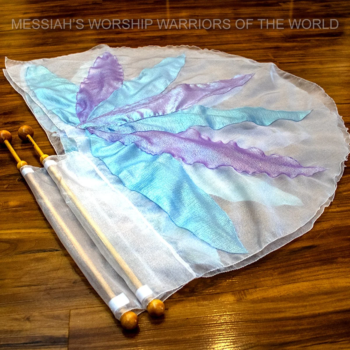 Spin-Tube worship flags with the image of a lily on them to represent how God provides for the lilies of the field in the same way He does for us.