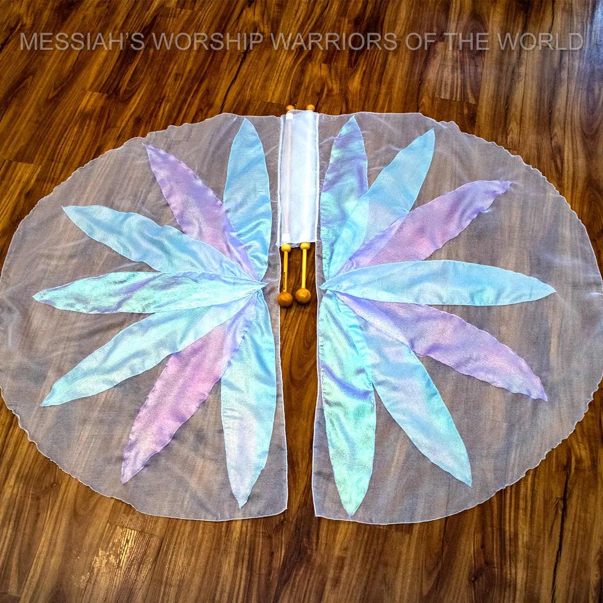 Spin-Tube worship flags with the image of a lily on them to represent how God provides for the lilies of the field in the same way He does for us.