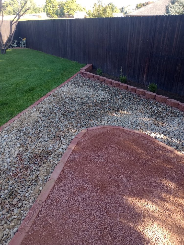 Low-maintenance gravel yard completed on Willow Lane in Bloomfield NM by Priddy Landscaping and Irrigation