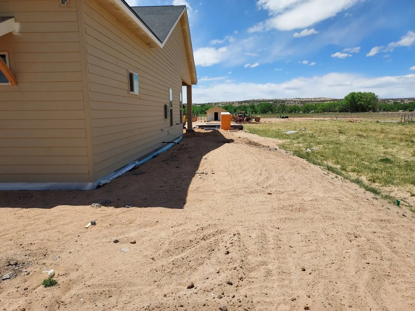 Gravel yard installation on Bessie Street in Aztec NM by Priddy Landscaping and Irrigation