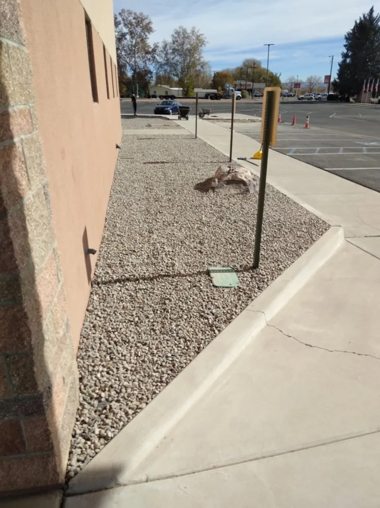 Low-maintenance gravel yard installed by Priddy Landscaping and Irrigation on Club House Drive in Farmington NM