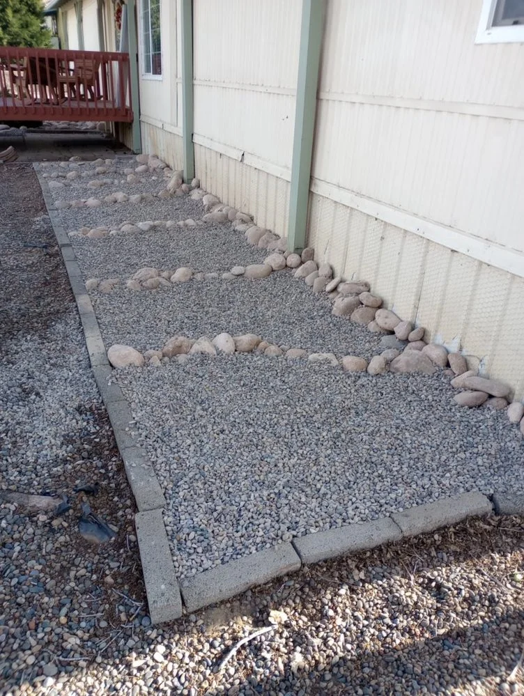 Decorative gravel landscaping completed by Priddy Landscaping and Irrigation near Putt Court in Farmington NM
