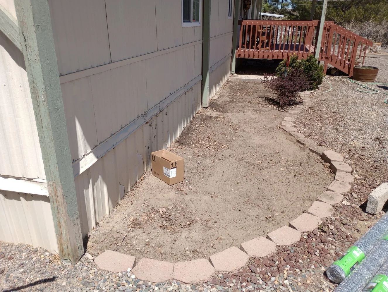Low-maintenance gravel landscaping on Sagebrush Drive in Aztec NM by Priddy Landscaping and Irrigation