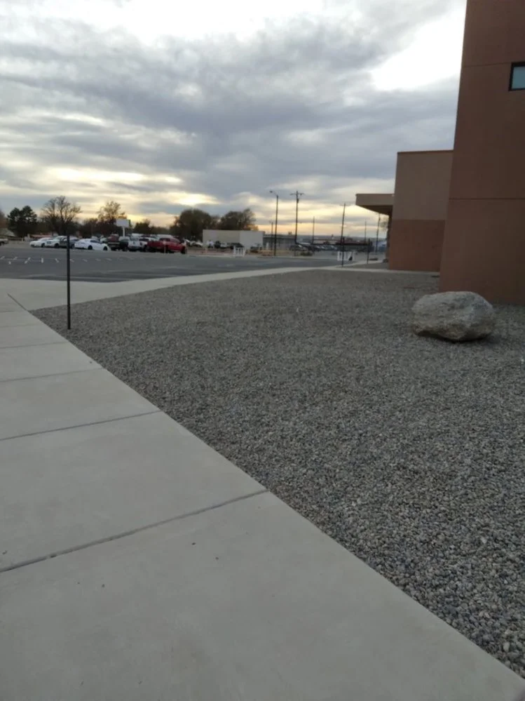 Decorative gravel yard completed near Via Del Oro Drive main entrance in Farmington NM