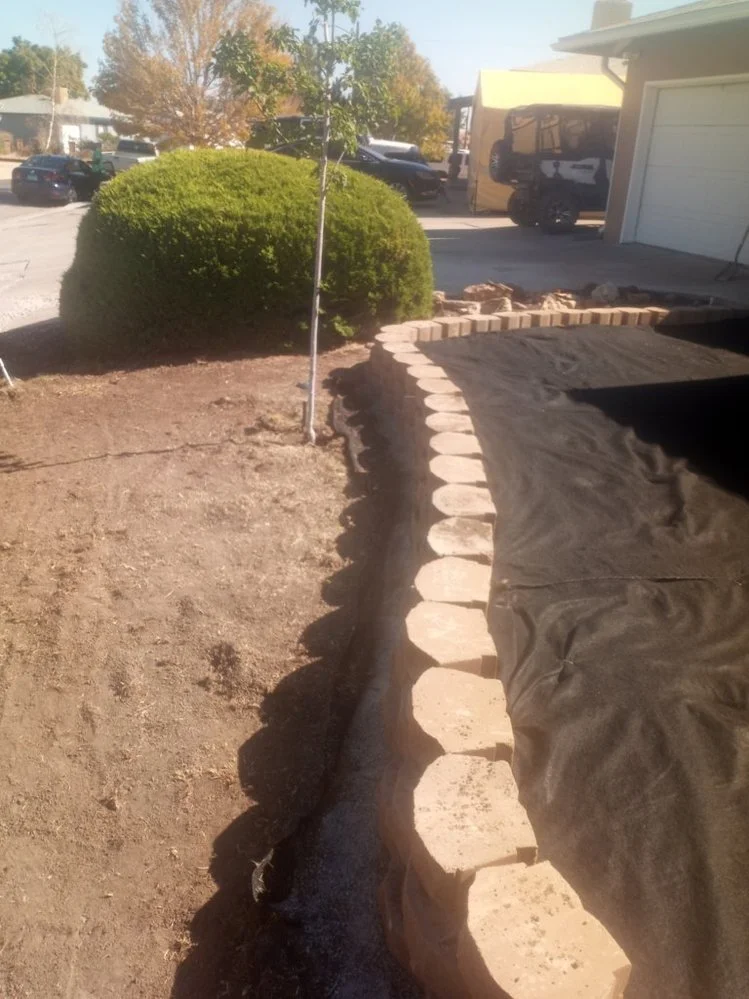 Low-maintenance gravel yard installed by Priddy Landscaping and Irrigation on Sandstone Drive in Farmington NM