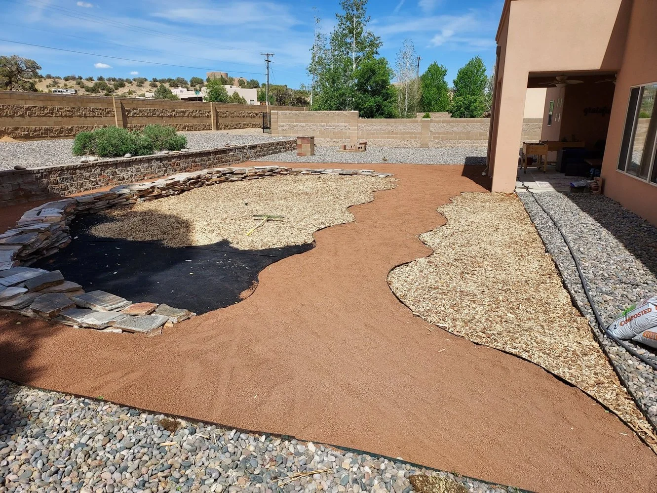 Gravel driveway installed by Priddy Landscaping and Irrigation along Aztec Boulevard in Aztec NM