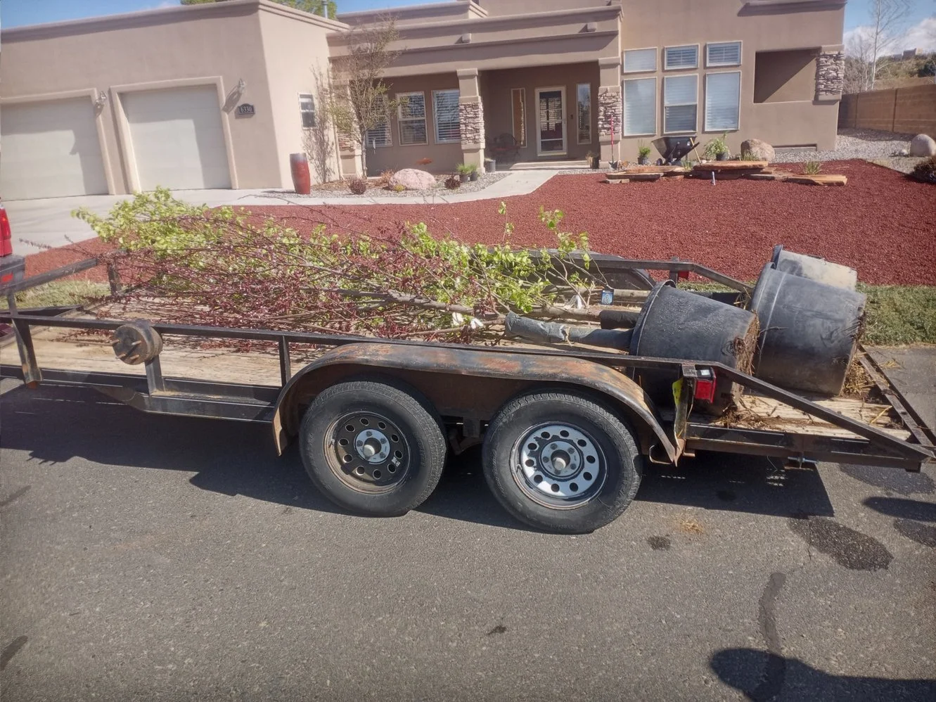 Low-maintenance gravel yard completed on North 2nd Street in Aztec NM by Priddy Landscaping and Irrigation