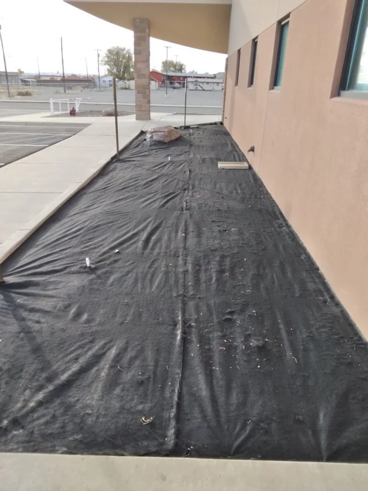 Front yard gravel landscaping on Baird Circle in Aztec NM by Priddy Landscaping and Irrigation