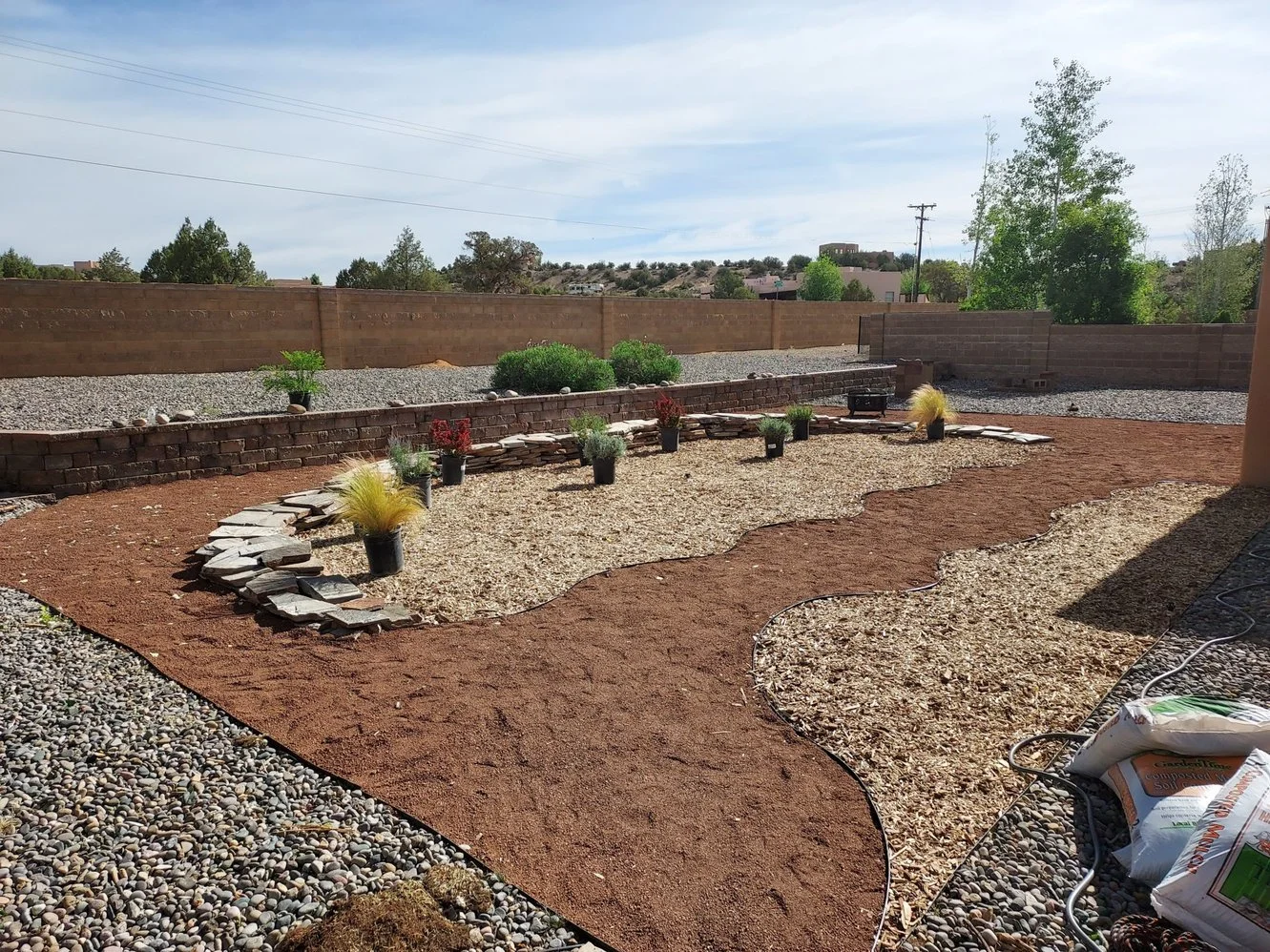 Professional gravel yard installation by Priddy Landscaping and Irrigation on Lakewood Street in Farmington NM