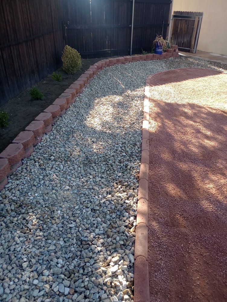 Front yard gravel refresh completed by Priddy Landscaping and Irrigation along Tuscany Way in Farmington NM
