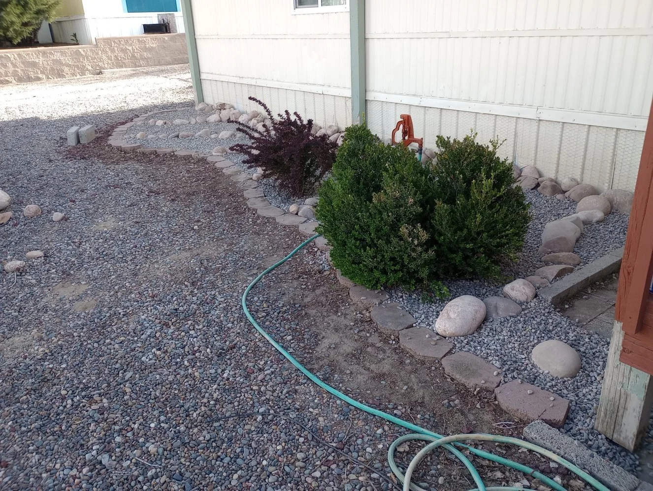 Low-maintenance gravel yard installed by Priddy Landscaping and Irrigation on Sandstone Drive in Farmington NM