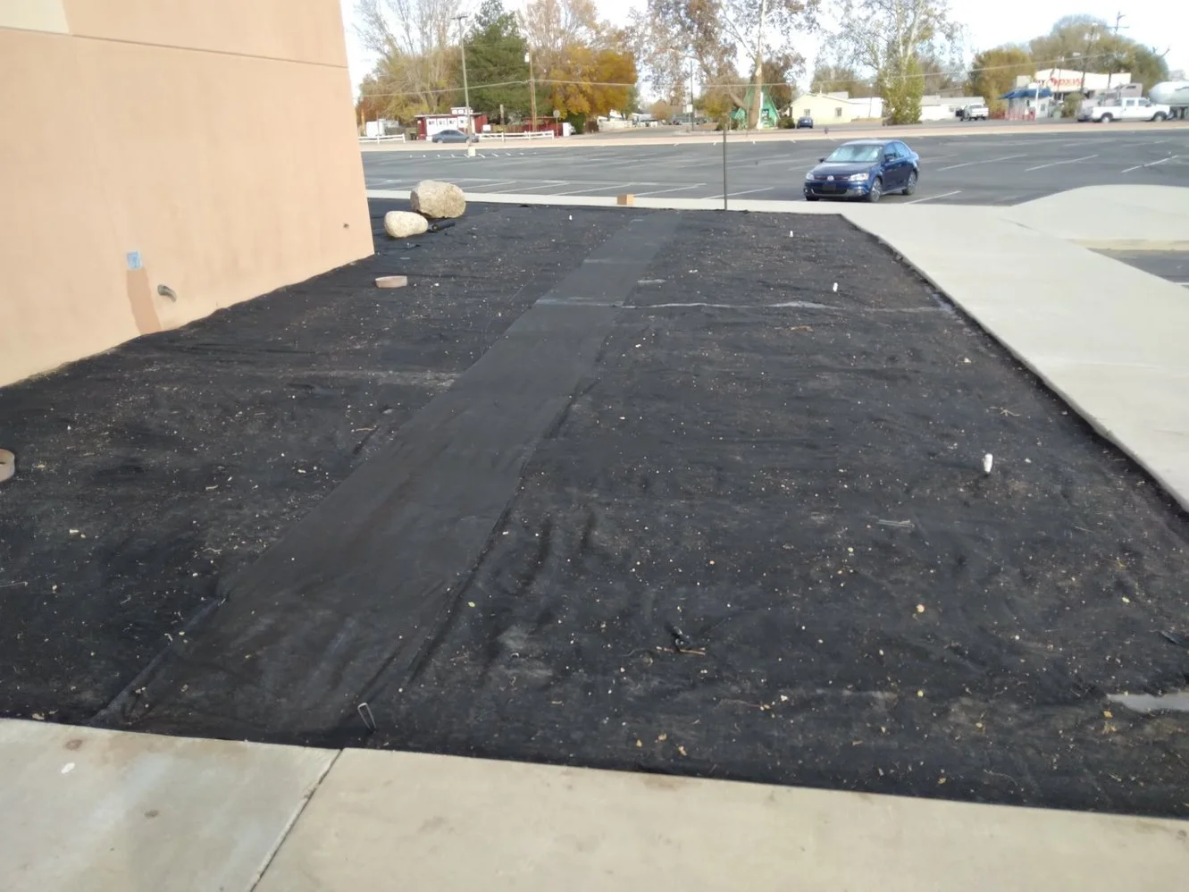 Decorative gravel installation on Ash Avenue in Bloomfield NM by Priddy Landscaping and Irrigation