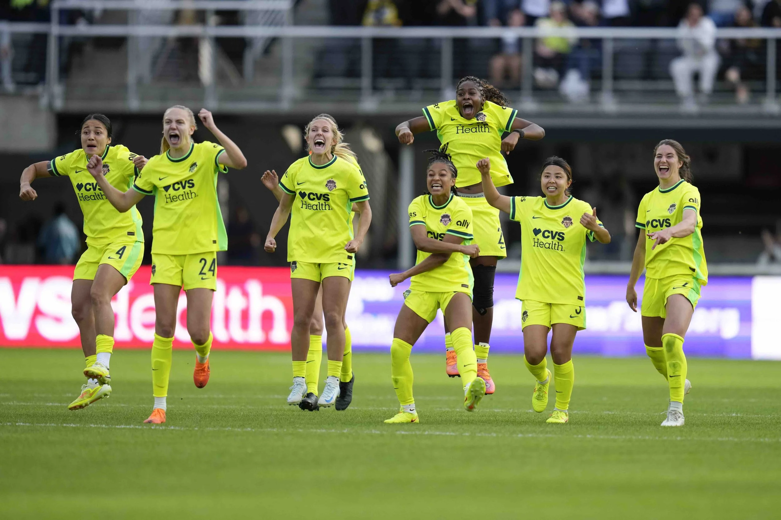 Washington Spirit players celebrate after beating Louisville in shoot out
