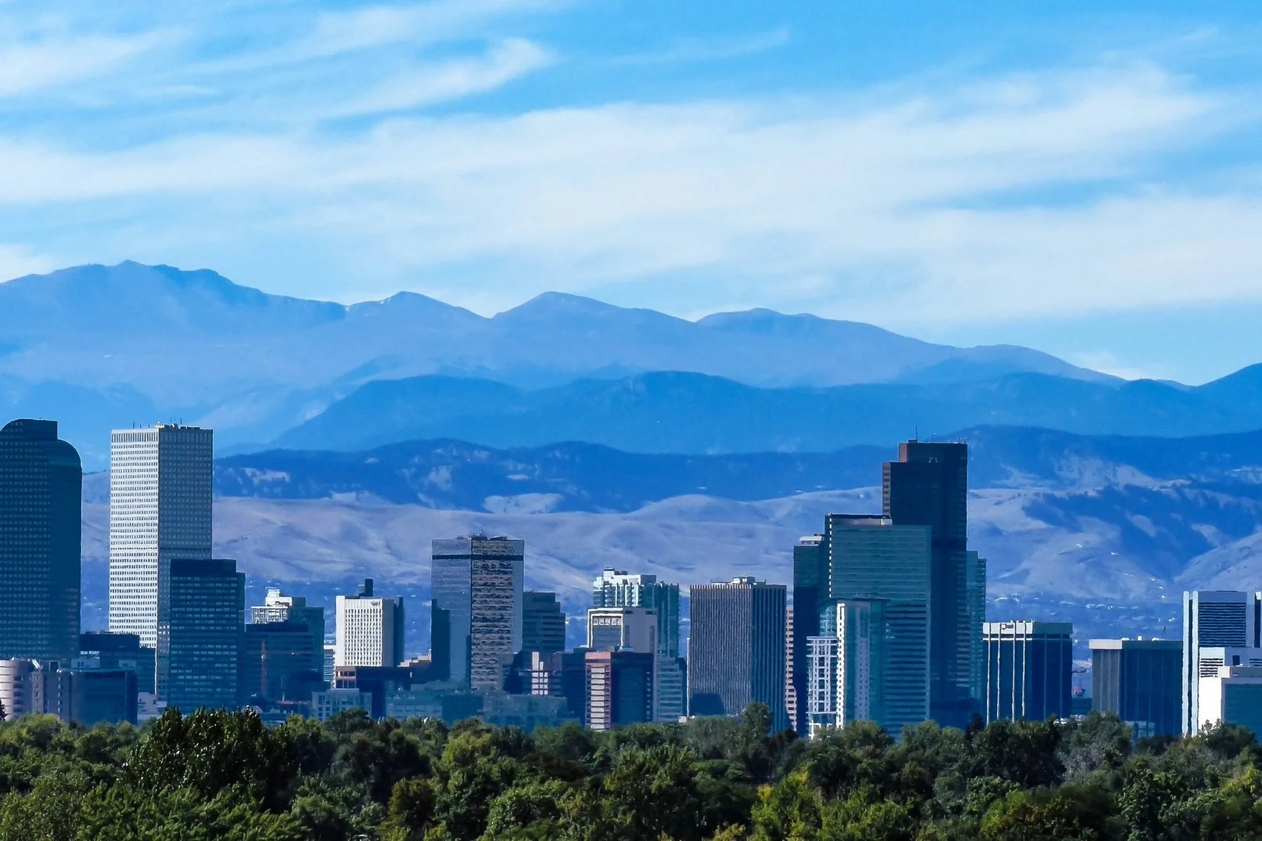 View of the Denver downtown skyline with the mountain range in the background