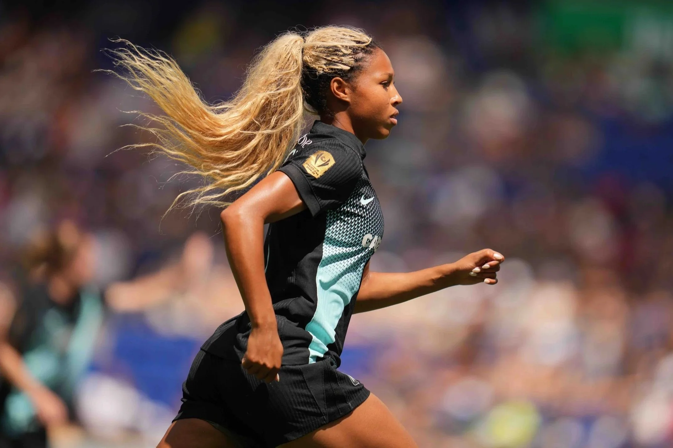 Midge Purce running while playing for NJ/NY Gotham FC