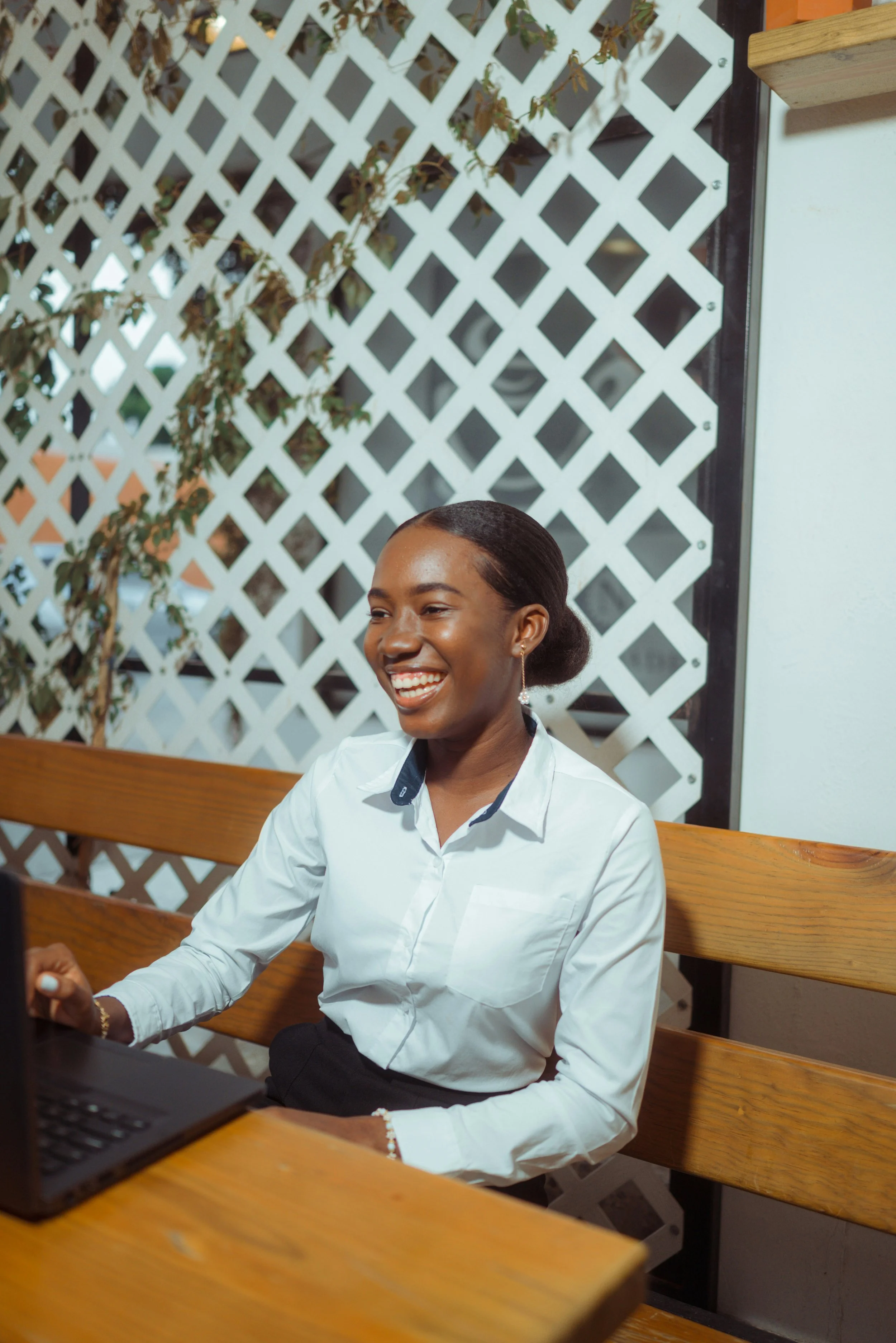 Adult woman smiling at a business meeting