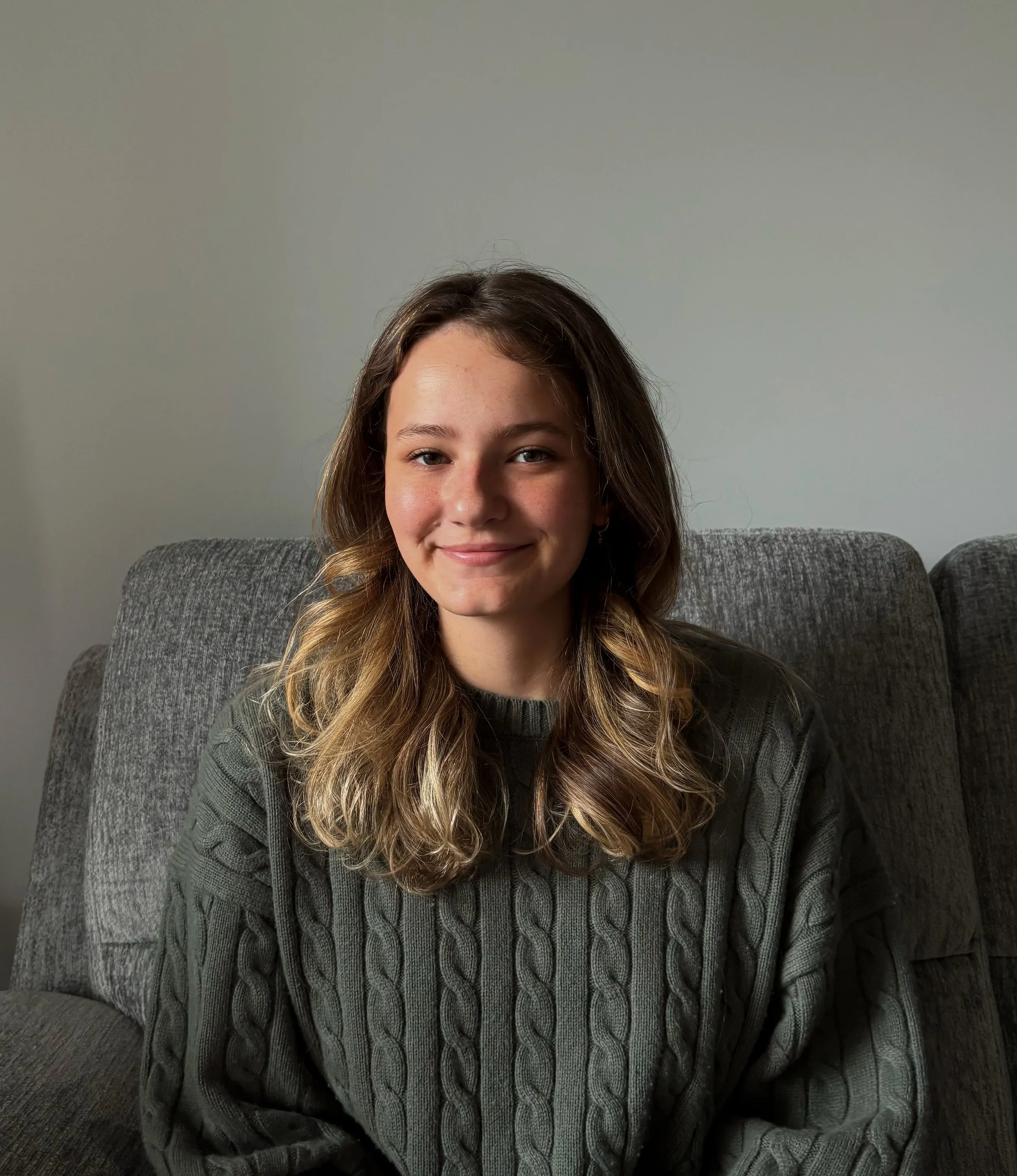 Anna Peet, therapist, sitting in a therapy office