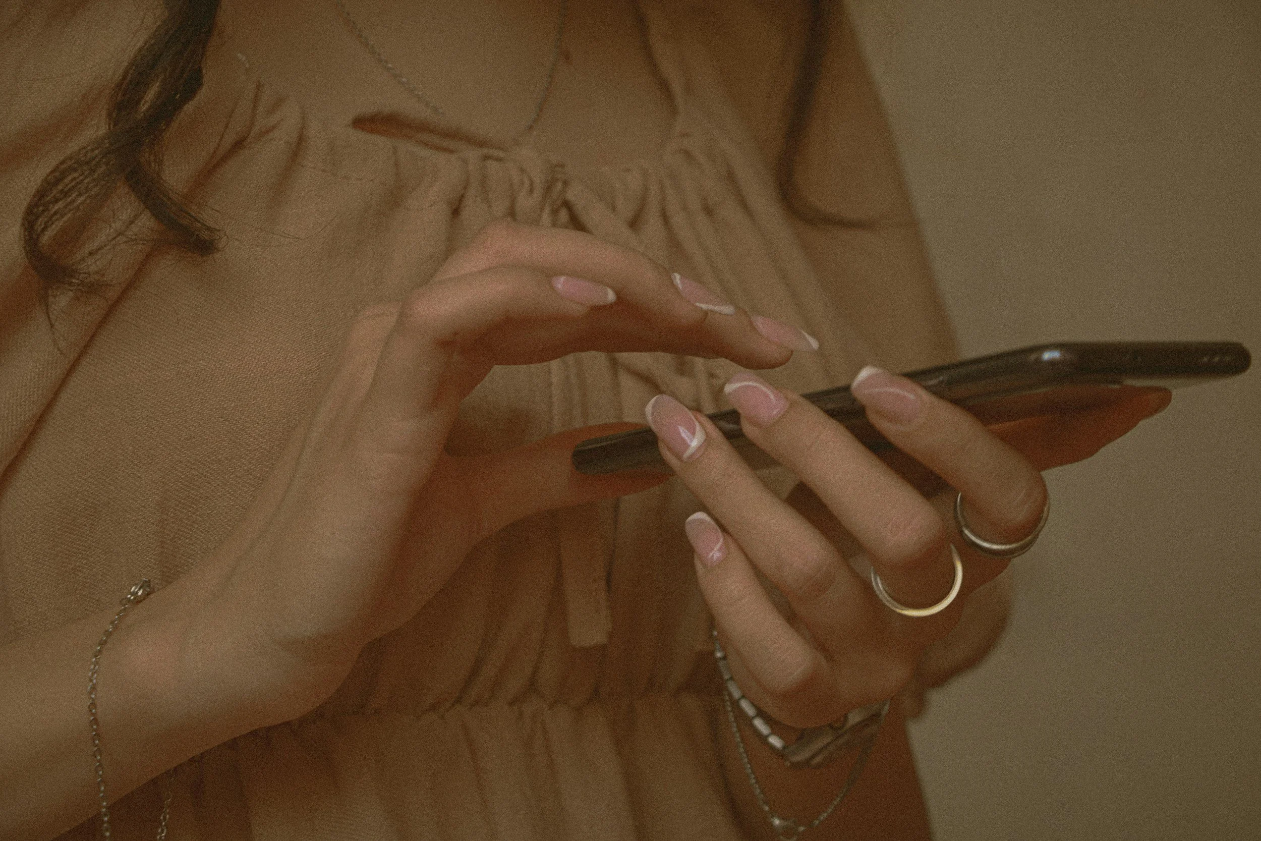 Potential Therapy client scrolling on their phone looking for a therapist