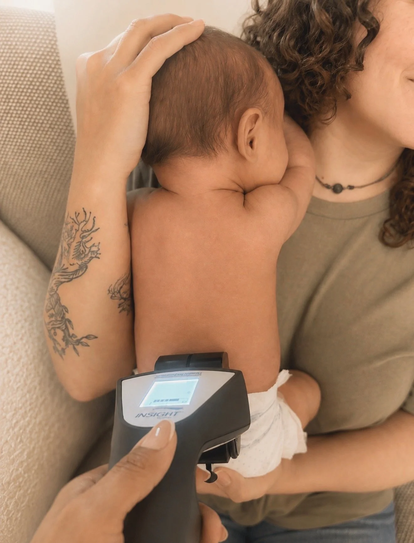 Infant receiving a gentle insight nervous system scan during a pediatric chiropractic evaluation