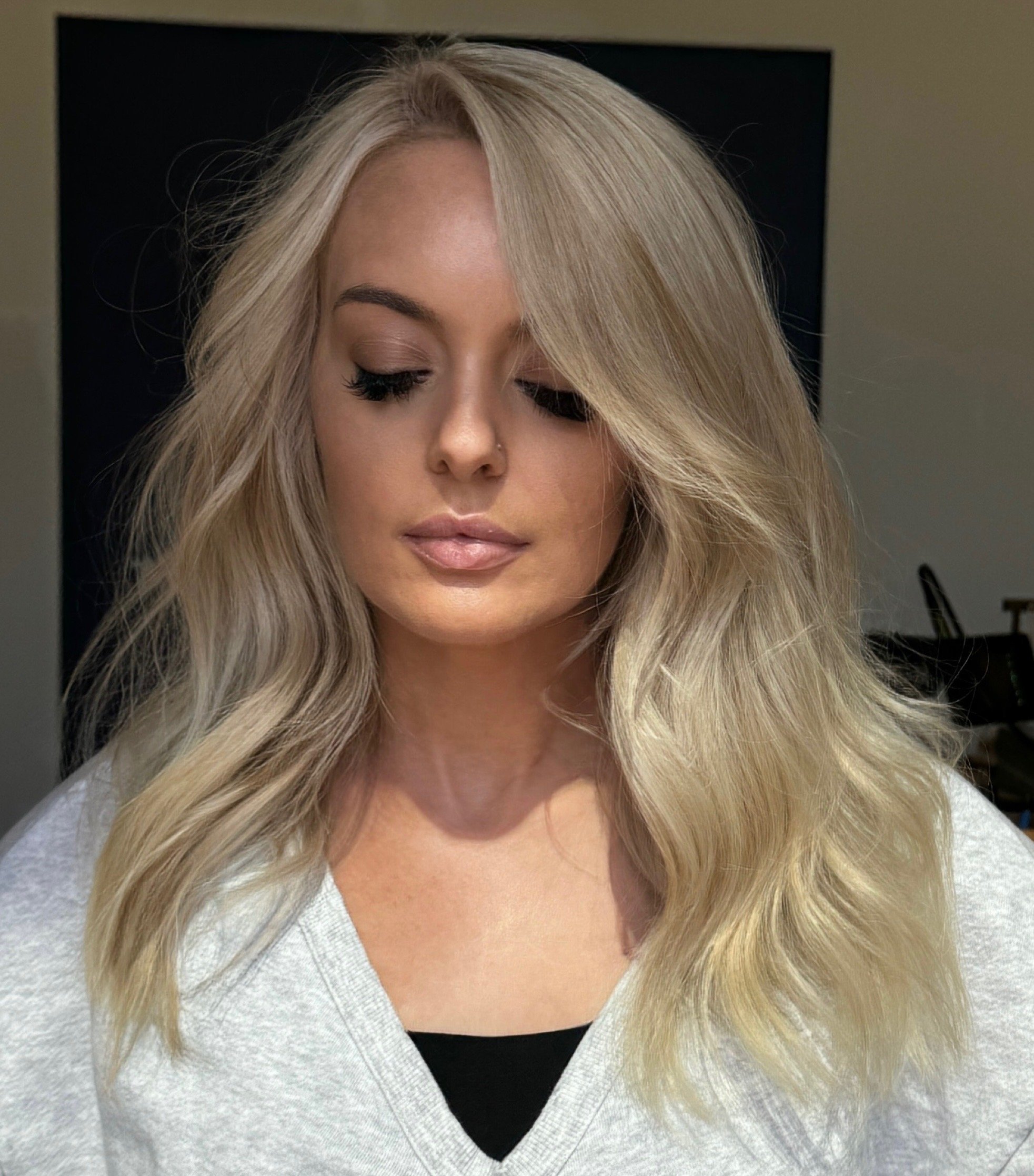 Bright ash blonde with face-framing pieces by Michael Joseph Hair in Norterra, North Phoenix