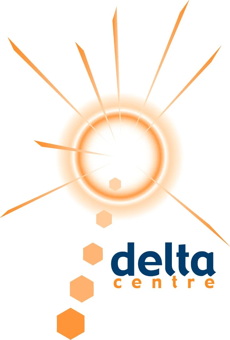 A bright, glowing orange burst with rays emanating outward, positioned above the text 'delta centre' in bold blue and orange font, with hexagonal shapes descending from the burst.
