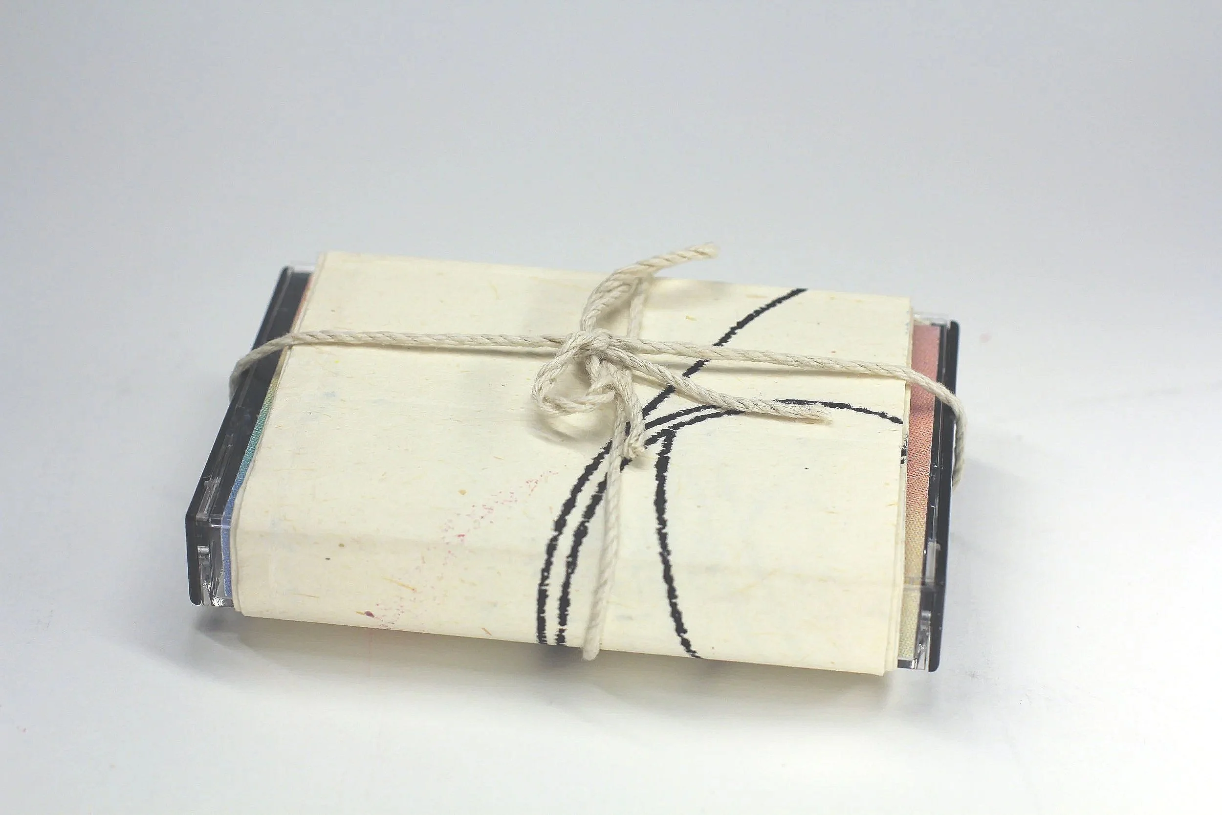 Light Loops by Alex Huang and Lily Campbell - 

Detail view of full package with bound outer sleeve and removed mobius strip exterior