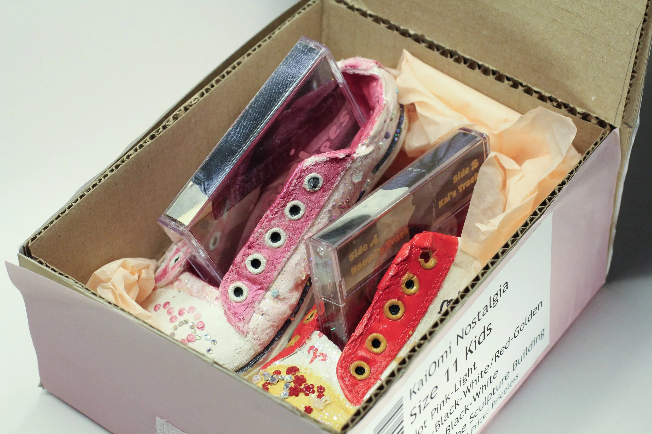 KaiOmi Tapes by Naomi Knight and Kai Chen -

KaiOmi tapes is a two tape collaborative edition produced along with cast plaster and a custom shoe box that pays homage to the light up shoe as it relates to childhood. Knight and Chen drew on their perso