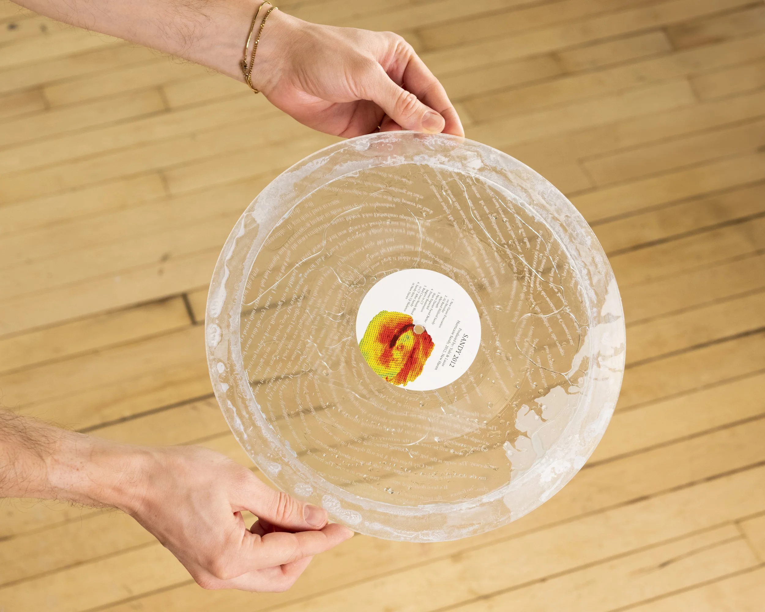 This lathe-cut, liquid-filled 12-inch record takes its inspiration from Hurricane Sandy, which struck the northeastern United States in 2012. One side features a composition layering audio from different news broadcasts covering the storm. The other 
