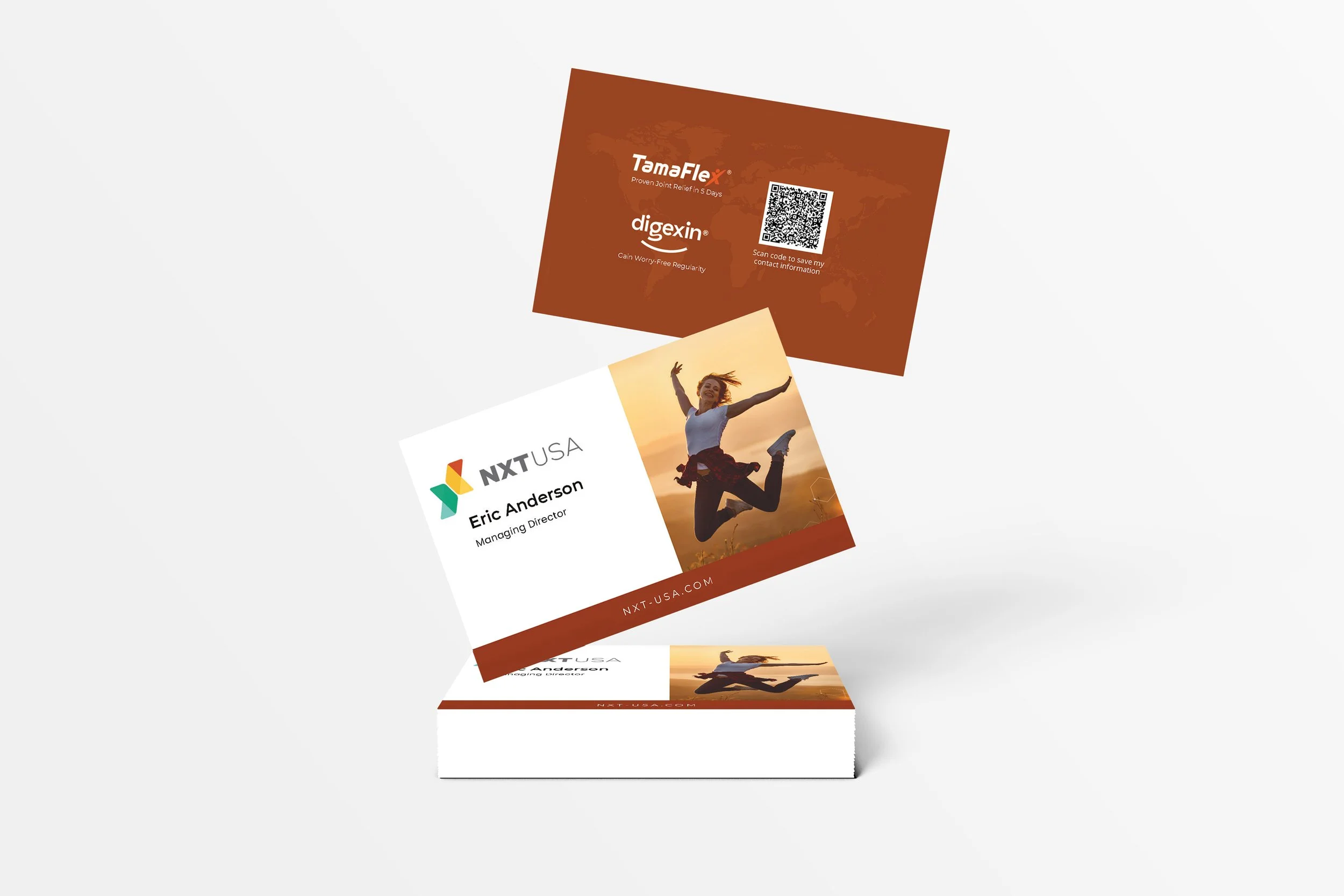 A business card with the company logo, name, and contact information, featuring a woman jumping in a field at sunset.