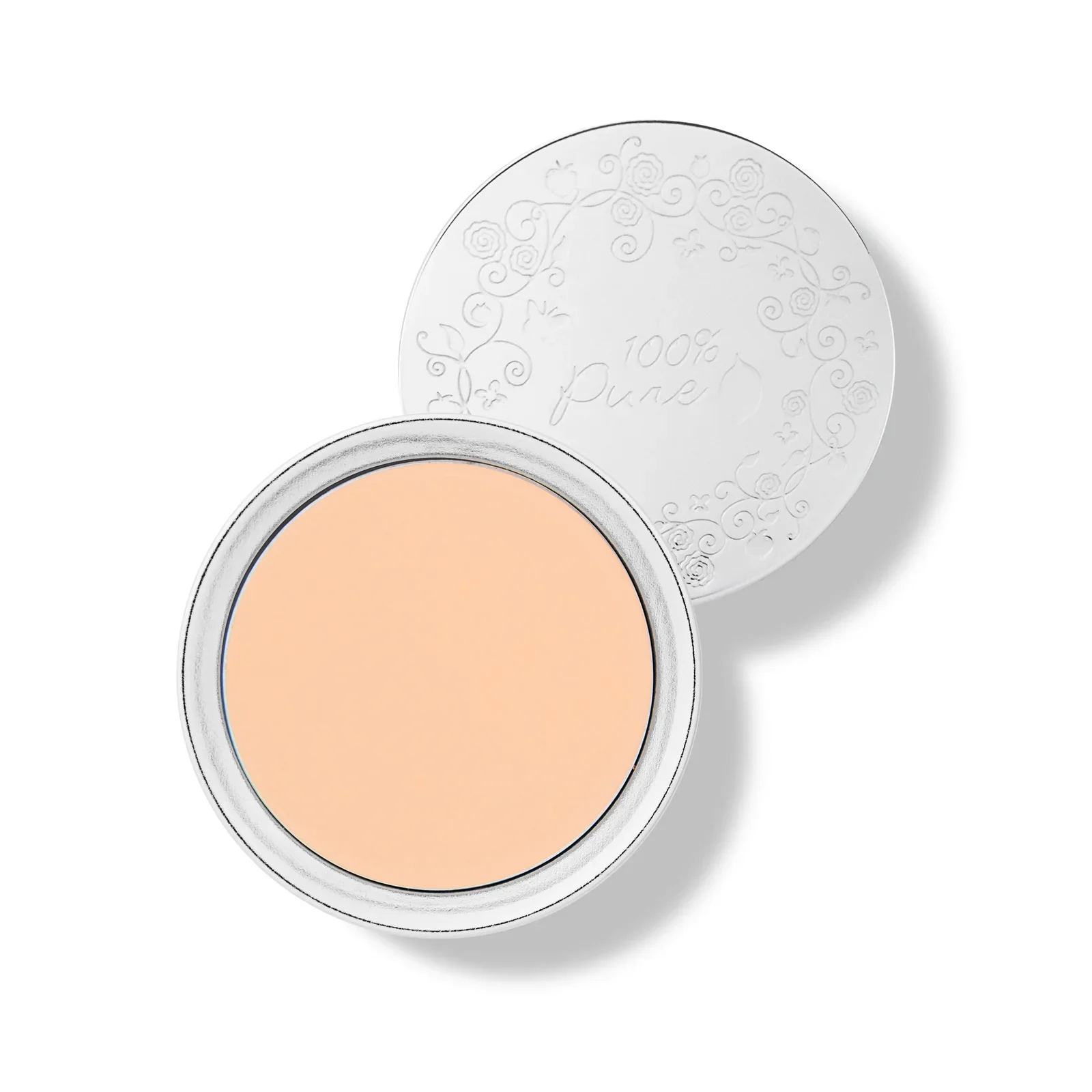 Open tin of peach-colored cream or balm with decorative white lid embossed with floral design and the words '100% Pure'