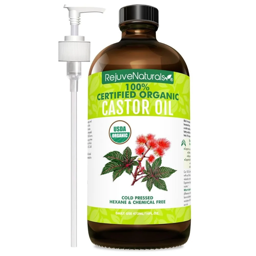 A bottle of RejuveNaturals branded organic castor oil with a pump dispenser, featuring a green and white label with an illustration of castor plant leaves and flowers, indicating it is USDA organic, cold pressed, hexane and chemical free, with a volume of 473 milliliters.