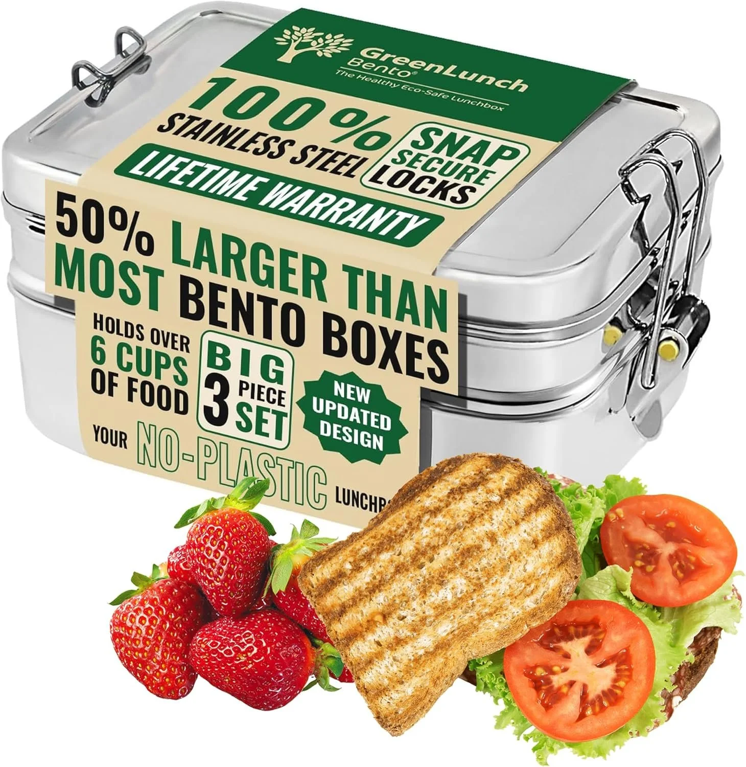 A Silver Bento lunch box with a label describing its features, including being 100% stainless steel, larger than most boxes, and with a lifetime warranty. The lunch box is accompanied by fresh strawberries, a grilled sandwich, and sliced tomatoes on a bed of lettuce.