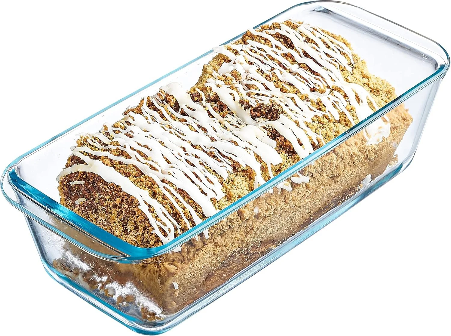 A glass baking dish containing a dessert with a crumbly topping, drizzled with white icing.