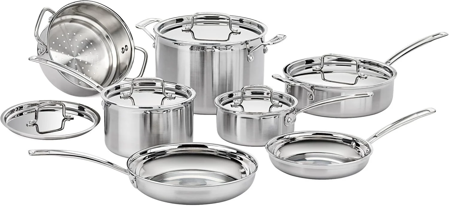 Set of stainless steel pots and pans, including small and large saucepans with lids, a frying pan, and a steaming insert.