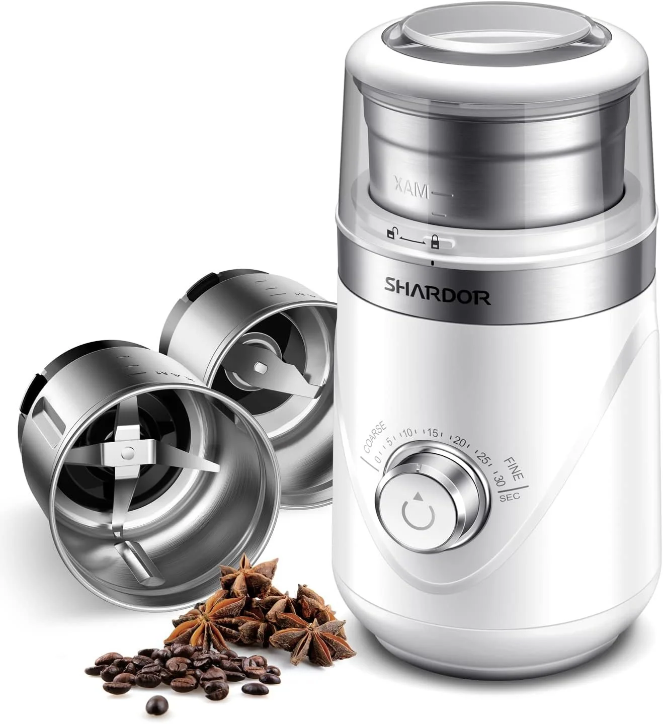 A white and silver electric coffee grinder with two detachable grinding containers and coffee beans and star anise placed in front.
