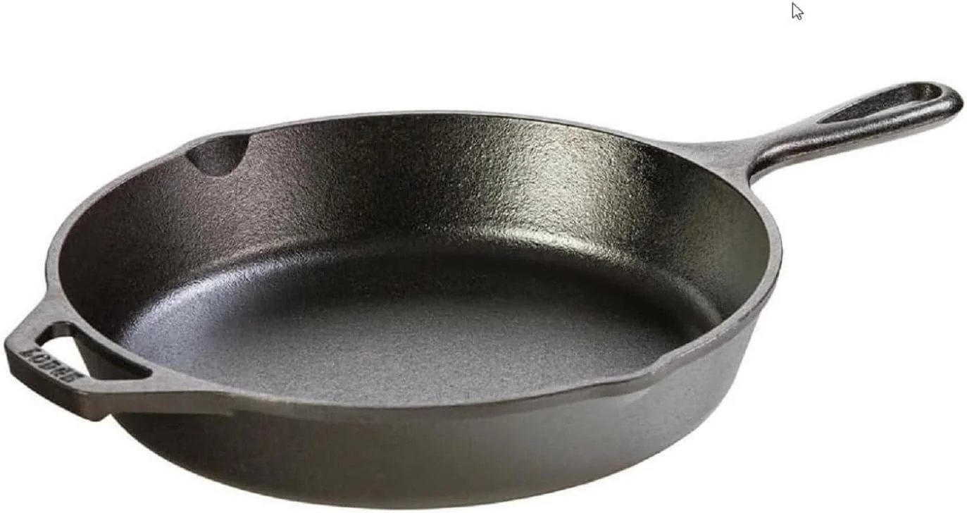 Cast iron skillet with handle, empty, showing a textured black surface.