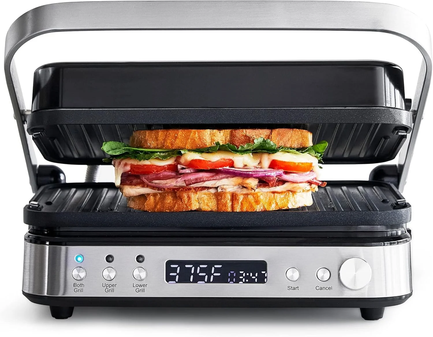 A sandwich with various meats, cheese, tomatoes, spinach, and melted cheese inside a toasted baguette, placed on a metal toaster grill with a digital display showing 375°F.