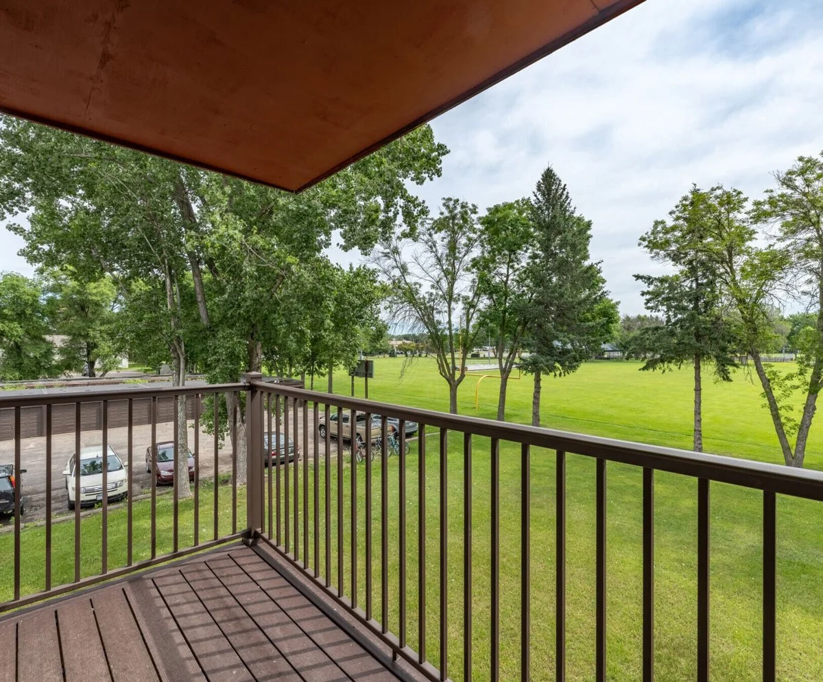 Pineview Apartments balcony in White Bear Lake overlooking green space