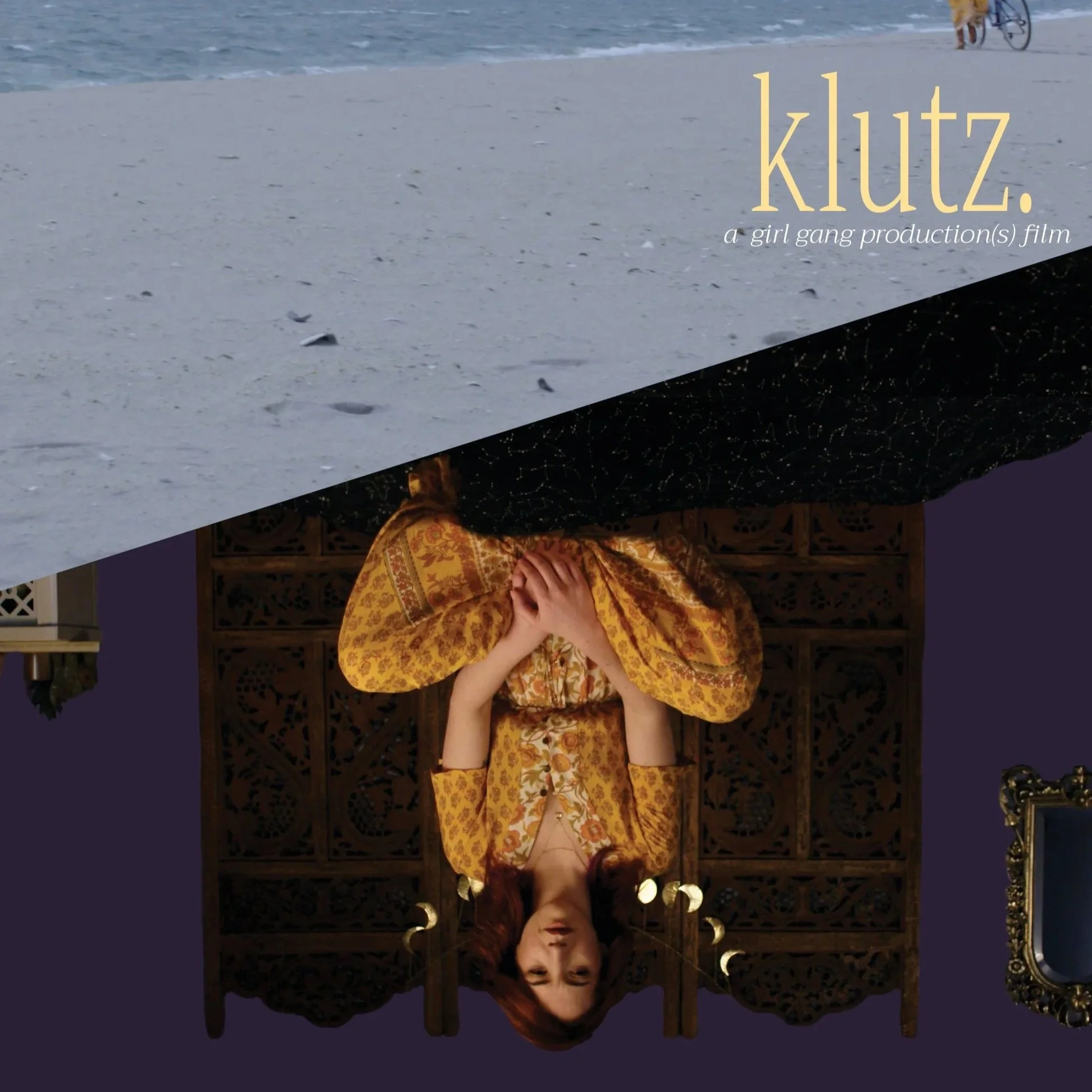 A woman dressed in a yellow patterned dress sitting in front of an ornate wooden backdrop, upside down, with her hands on her chest. The top half of the image shows a sandy beach with a bicycle and a dog in the background, also upside down. The overlay text reads 'klutz. a girl gang production(s) film'.