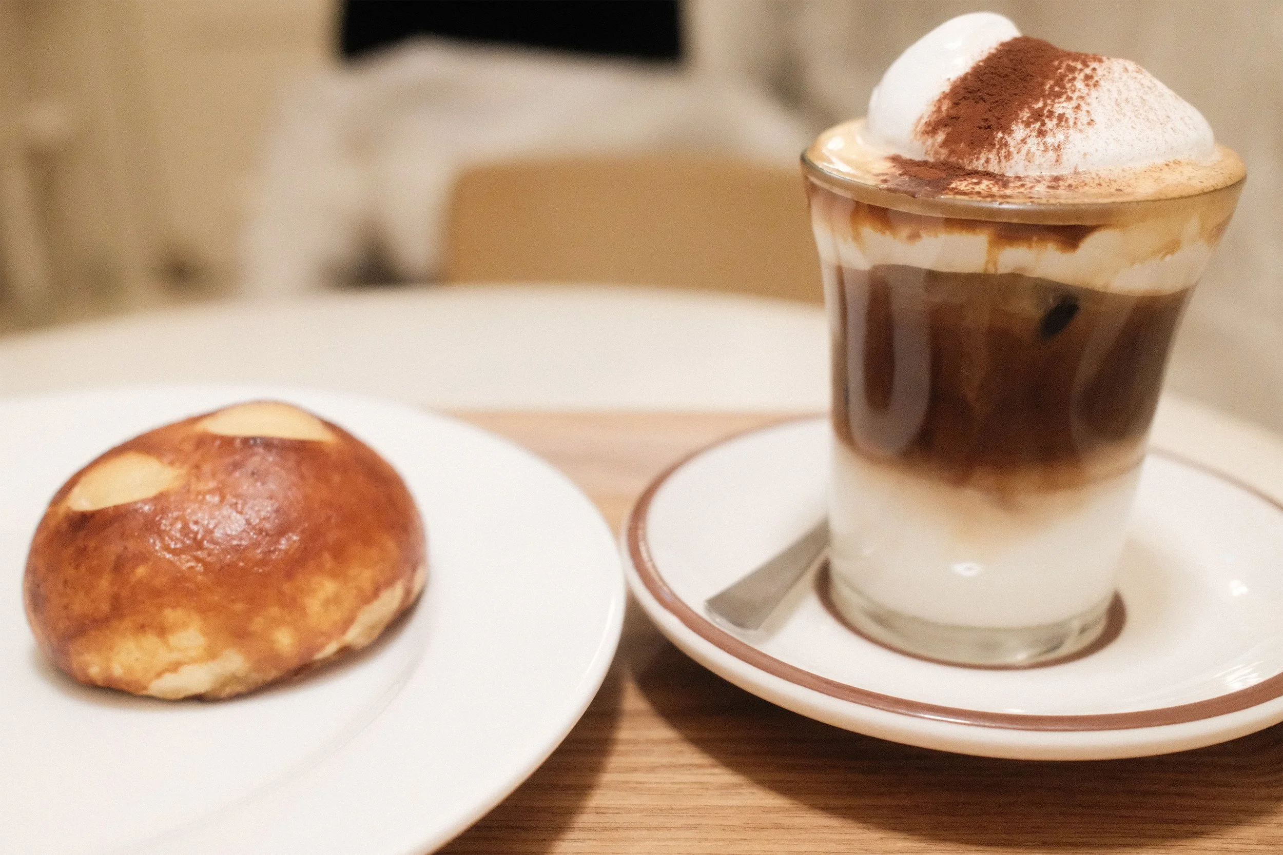 Simple Bread Scone and einspanner latte served on plates