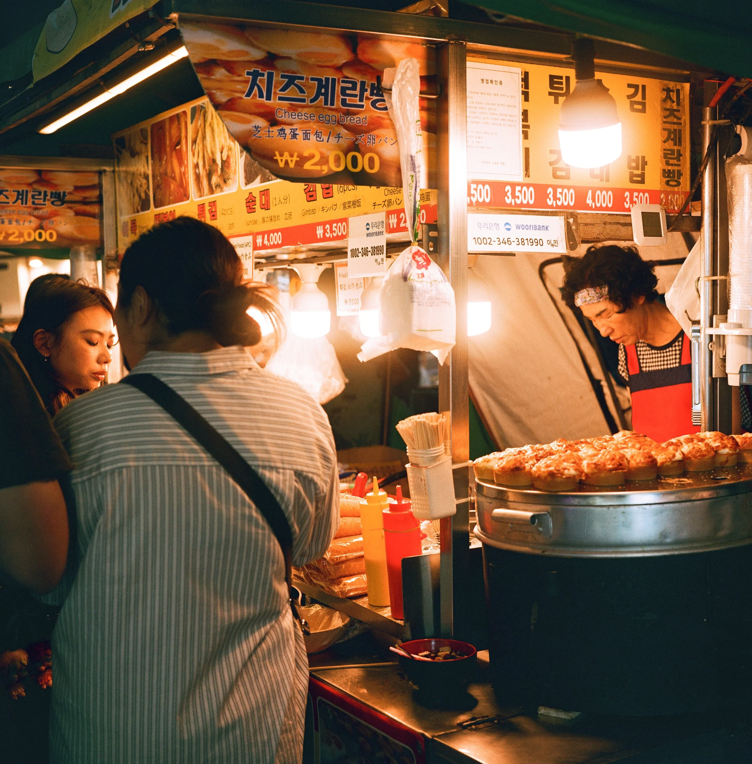 Night time film photo of a street booth in Seoul, South Korea
