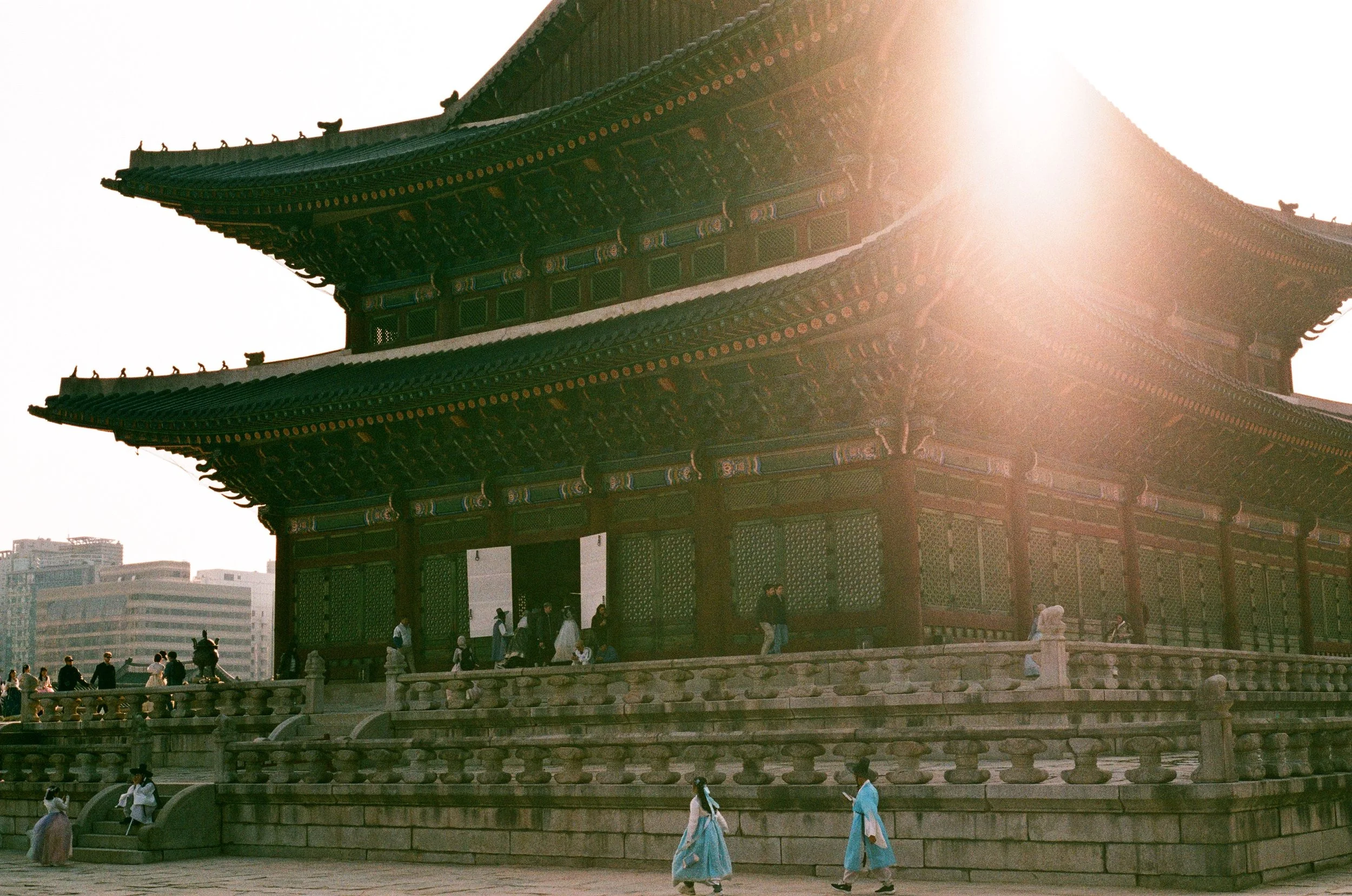 Gyeongbokgung Palace being enjoyed by people wearing traditional Korean Hanboks