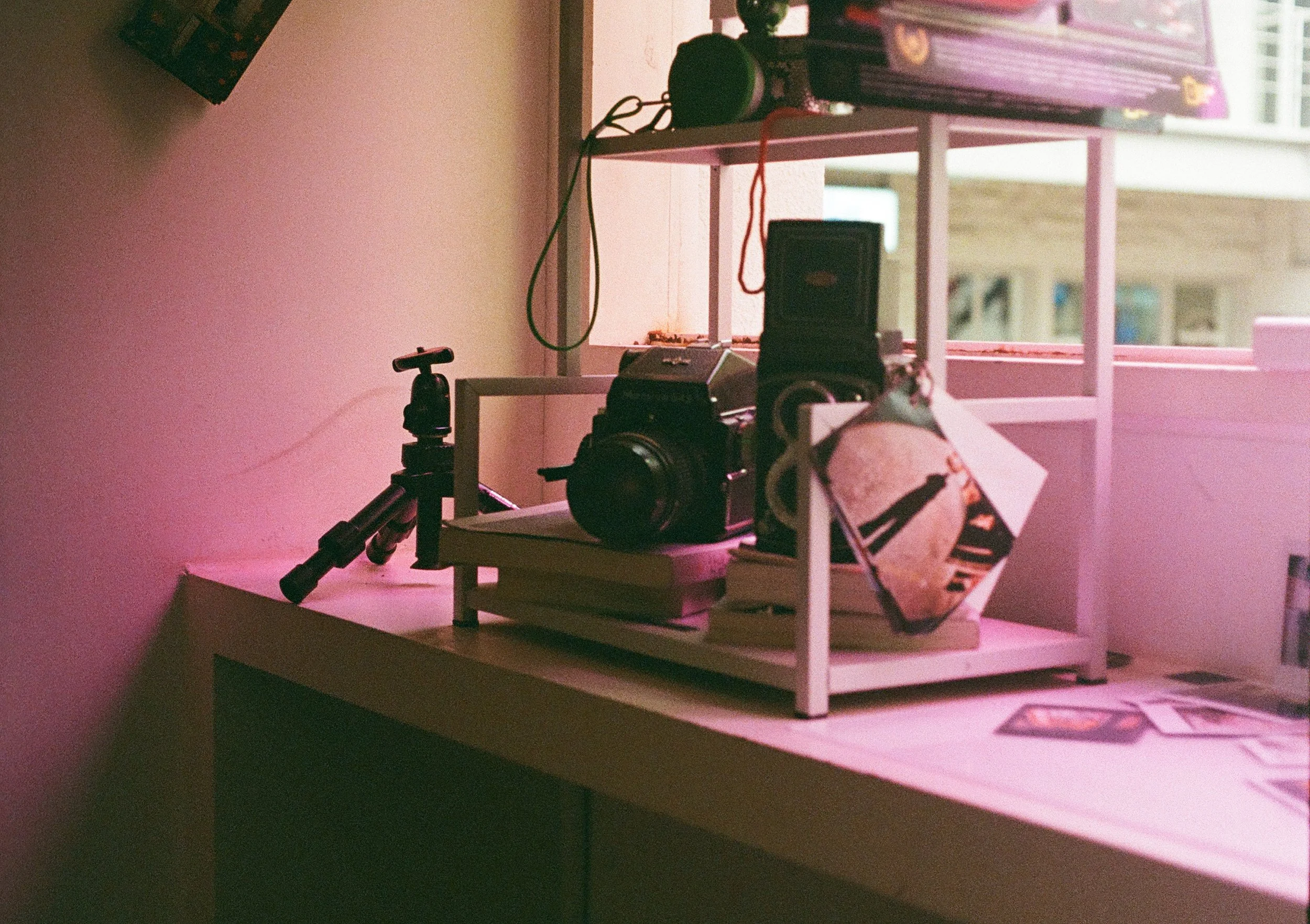 Out of focus image of medium format cameras in a camera shop taken on Olympus Pen F film camera.