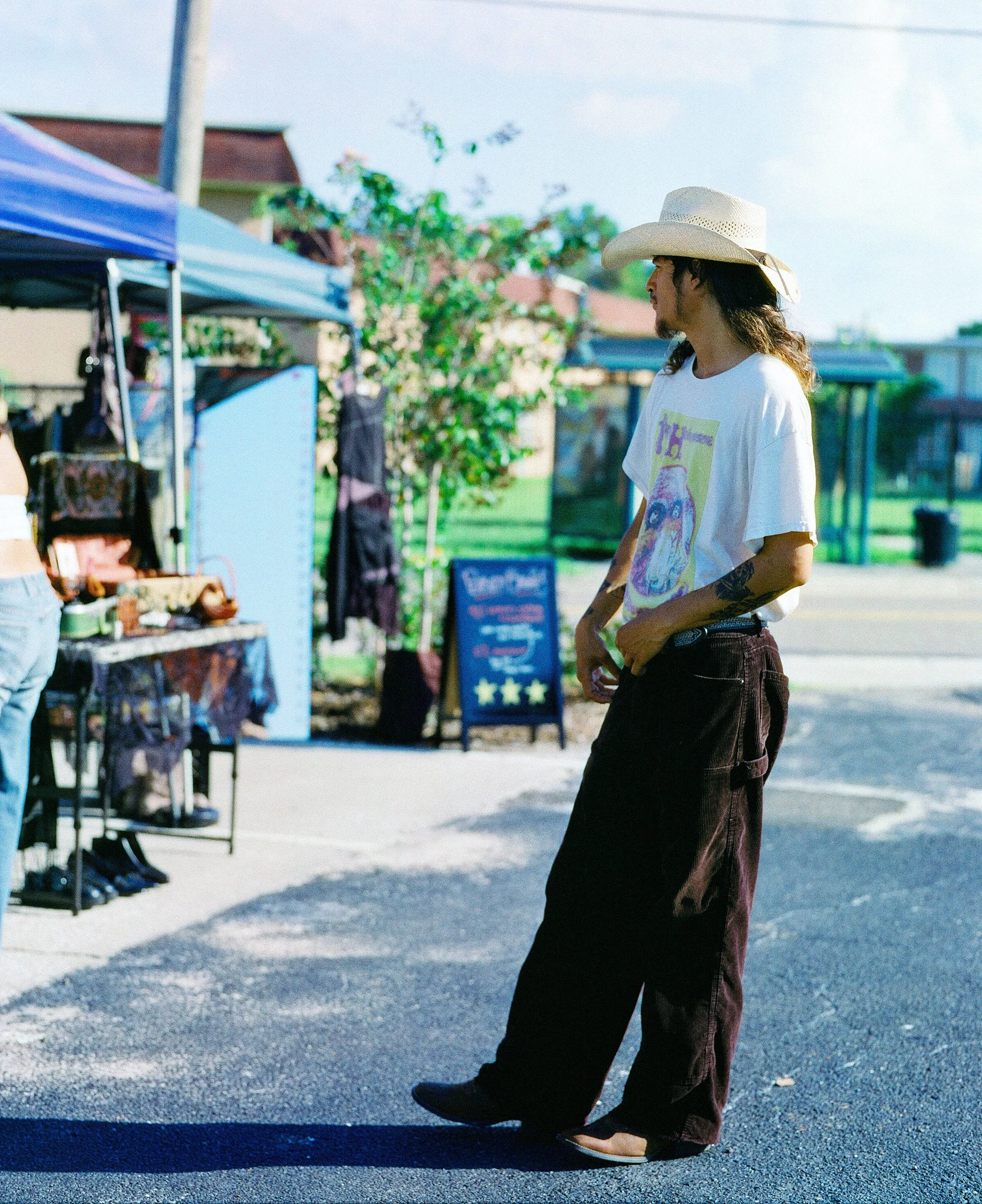 Image of a man wearing western cowboy attire taken on film